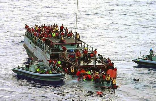 Australian navy rescue asylum-seekers from a sinking boat off Christmas Island in October 2001. The government concoted a story that children were thrown overboard by refugees in an effort to stay in Australia